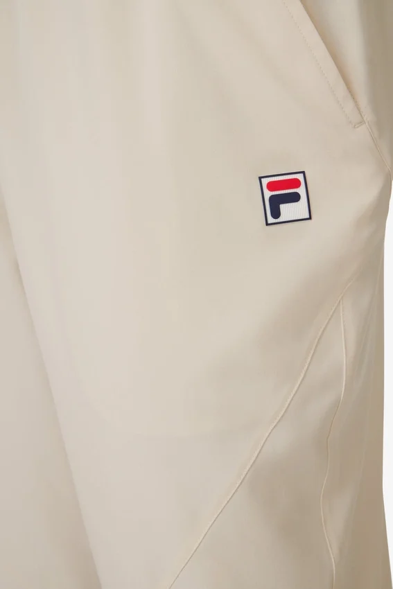 Pantalón deportivo de tenis tejido para cancha, color beige