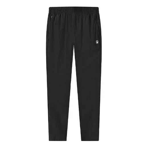 Pantalones largos deportivos holgados con estampado de logotipos atléticos, color negro