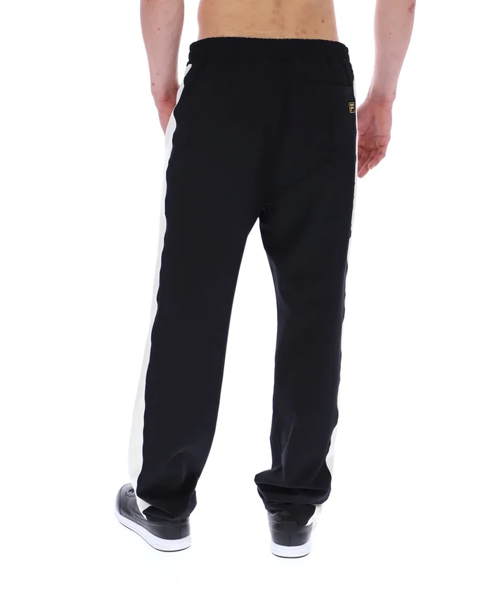 Pantalones negros inspirados en el tenis de Ali