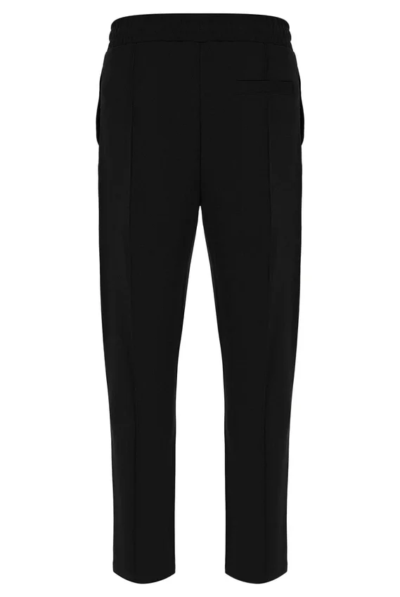 Pantalones negros Molveno de corte ajustado con pliegues finos