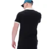 Polo de manga corta Panatta 2 en negro con pantalones cortos